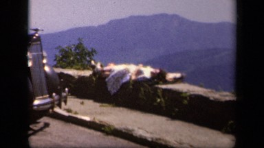 1943: girl is sleeping on stone SKYLINE DRIVE VIRGINIA