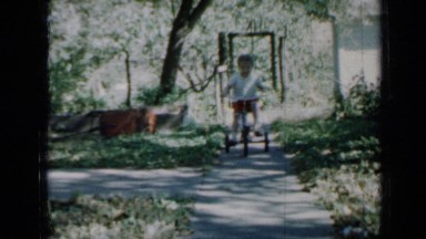1958: home video of child riding tricycle MINNESOTA