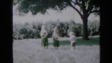 1958: three children are walking on grasslands whose are brother & sisters
