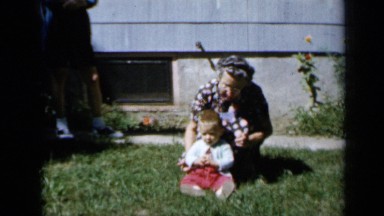 1958: clips of family gathered around garden MINNESOTA
