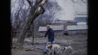 1958: man walking and training dog. MINNESOTA