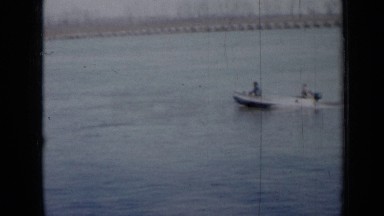 1958: two friends are traveling on boat through river and other two people