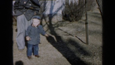 1958: little boy playing here and there,play also with his dog MINNESOTA
