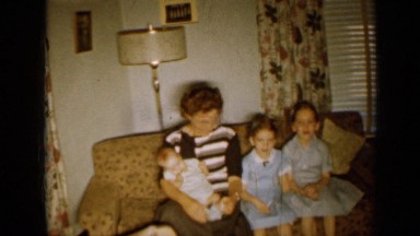 1958: the three children and one baby sitting with their mother MINNESOTA