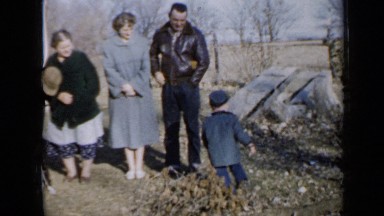 1958: the family is standing, boy is running around MINNESOTA