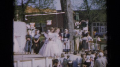 1959: beautiful bride walking along with her bridesmaid to wedding place IOWA