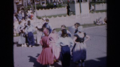 1959: men and women perform square dance in public wearing country costumes IOWA