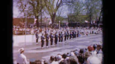 1959: american soldiers perform drill in front of crowd and american flags IOWA