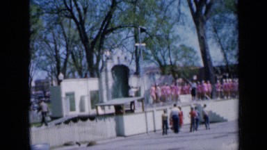 1959: young girls practicing jump rope routines with two men twirling rope