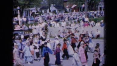 1959: people gathered and walking on road IOWA
