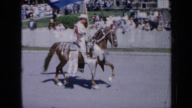 1959: men marching down street during parade IOWA