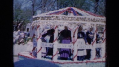 1959: group of happy nuns riding in elaborately adorned pavilion shaped parade
