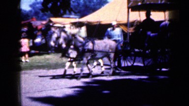 1959: display of several fair-like attractions in rural setting. IOWA