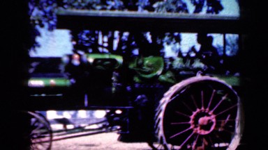1959: an old automobile rolling down road IOWA