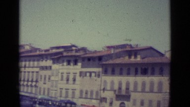 1962: villas located in straight line view, vehicles are parked near villas