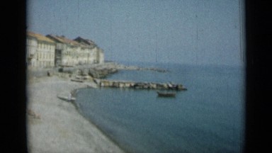 1962: small town on shore of sea with many buildings, roads etc MONACO