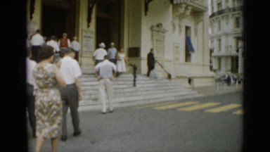 1962: group of people walking up to building MONACO