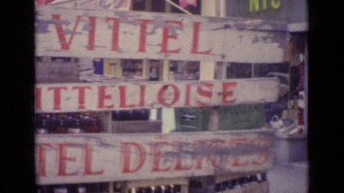 Truck Carrying Lots of Bottles with Man Standing Alongside in Paris