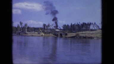 1971: Videographer on Boat Films Black Smoke Plume from Shoreline Moscow Russia