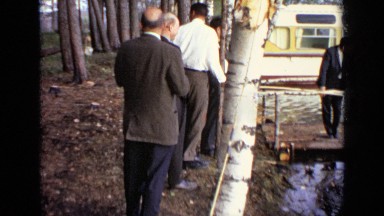 1971: group of men in suits fishing in small creek MOSCOW RUSSIA