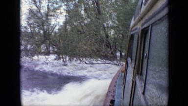 1971: the boat is travelling very fast, place in middle of forest. MOSCOW RUSSIA