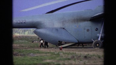 1971: several businessmen leaving out back end of helicopter after touring it.