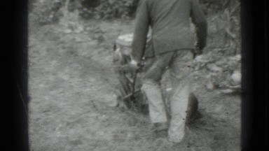 1975: man plowing ground with gas power tiller RUSSIA