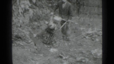1975: technology of gardening, man with gardening machine, machine saves time