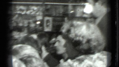1975: party of children gathered around dining table, enjoying group of people