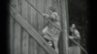 1983: man woman and girl climbing wooden staircase, one behind other RUSSIA