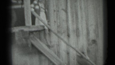 1983: two children and mature woman descending very rustic outdoor stairs