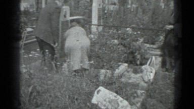 1983: an elderly couple tending to their garden, with assistance RUSSIA