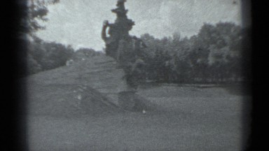 1983: man is running from temple that is having big open statue. RUSSIA