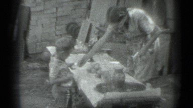 1983: mother feeds baby at dining hall, lunch ready baby starts feeding