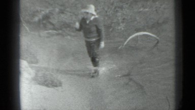 1983: Lady Enjoying Vacation with Husband Walking in Water Russia