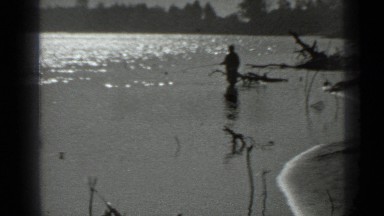1983: gentleman fishing in source of water, change scene to boat by shoreline
