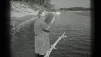 1983: the woman uses fishing needle to catch fishes and she is enjoying nature