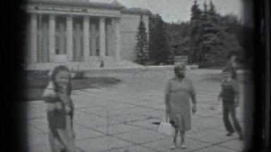 1983: two kids are playing in front of their mother at place of mosque. RUSSIA