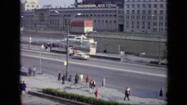 1971: the people walking and cars moving on road