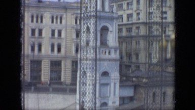 1971: buildings and roads surround tower with arched openings and finial MOSCOW