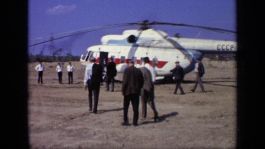 1971: group of business men walking towards cccp - 22462 helicopter meeting