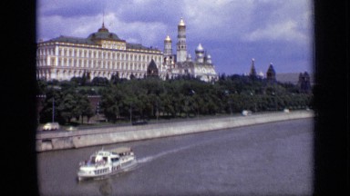 1971: cruise ship traveling along river and passing by official building MOSCOW