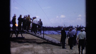 1971: business men gathering on dock to watch fire across water MOSCOW RUSSIA