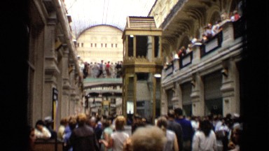 1971: crowded metropolitan area during day with hundreds of men and women