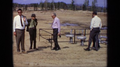 1971: Group of Formally Dressed Executives Walking Back to Vehicle After Site Inspection in Moscow