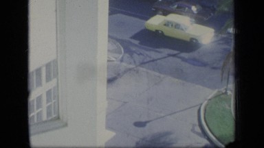 1970: view of traffic on street from high vantage point across from pizza