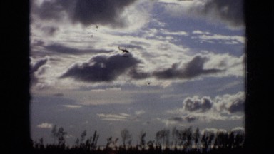 1971: helicopter flies just under the clouds, and over the trees MOSCOW RUSSIA