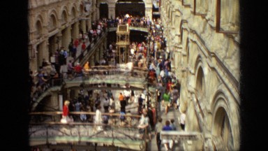 1971: crowds of people crossing pedestrian bridges in shopping mall MOSCOW