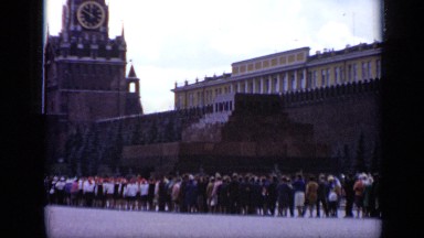 1971: large number of people moving as queue near to spectacular building MOSCOW