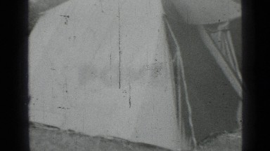 1967: Man Removing Cloth from Car in Russia